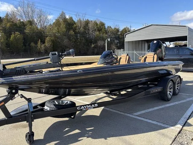 Slide: The Image of 2025 Caymas XS 21 Pro boat on trailer, parked outdoors. - 15