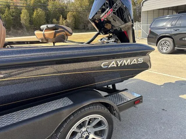 Slide: The Image of 2025 Caymas XS 21 Pro boat on trailer, featuring sleek design and powerful engine. - 17