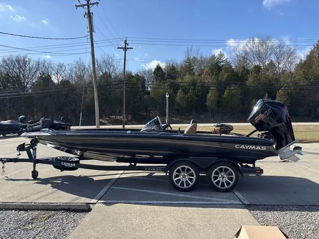 Slide: The Image of 2025 Caymas XS 21 Pro boat on trailer, parked outdoors. - 18