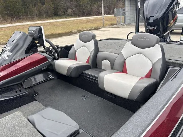 Slide: The Image of 2015 Skeeter ZX 225 boat interior with dual seats and steering console. - 13