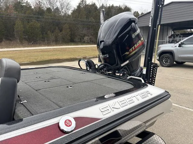 Slide: The Image of 2015 Skeeter ZX 225 boat with Yamaha engine, parked outdoors. - 14