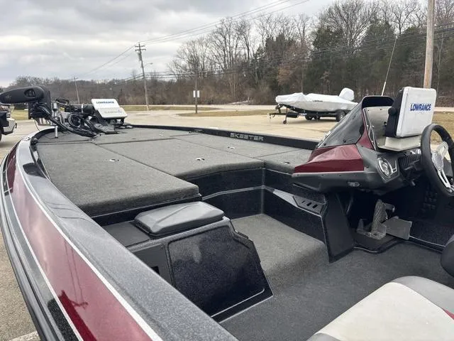Slide: The Image of 2015 Skeeter ZX 225 bass boat with Lowrance electronics, spacious deck, and steering console. - 15