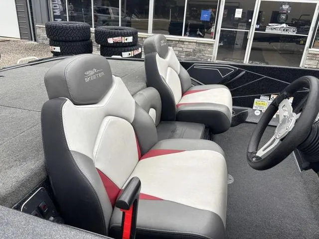 Slide: The Image of 2015 Skeeter ZX 225 boat interior with dual seats and steering wheel. - 6