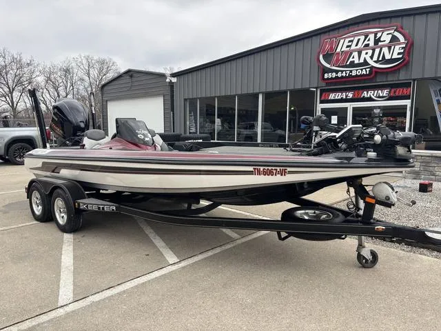 Slide: The Image of 2015 Skeeter ZX 225 boat on trailer outside Weda's Marine dealership. - 9