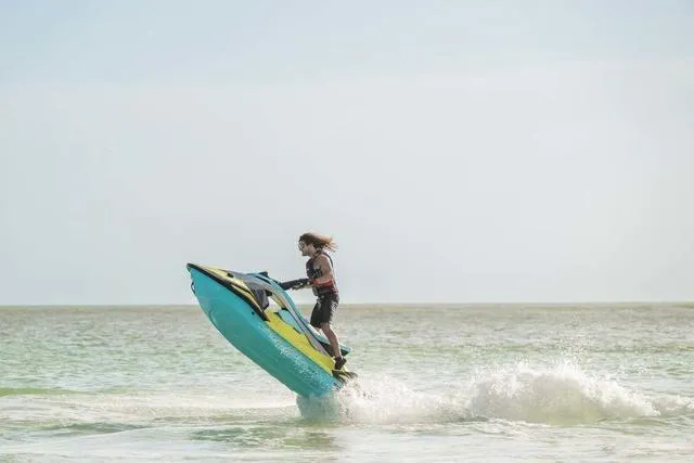 Slide: The Image of Person riding 2025 Yamaha Waverunner Jetblaster on the ocean, performing a jump. - 7