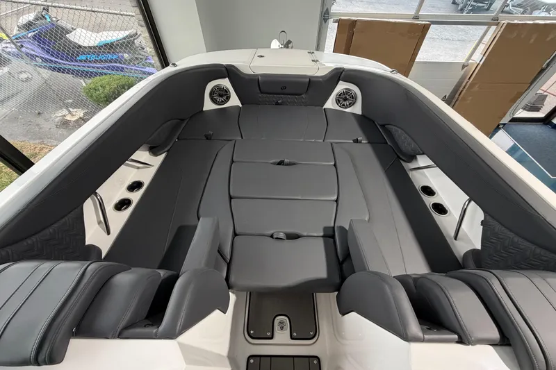 Slide: The Image of 2025 Hurricane Sundeck SD 2600 OB boat interior with spacious seating and modern design. - 18