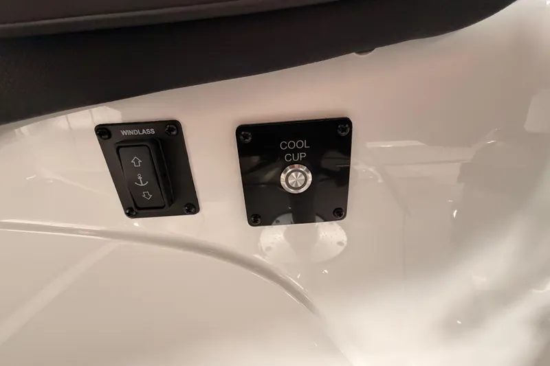 Slide: The Image of Control panel on 2025 Hurricane Sundeck SD 2600 OB boat featuring windlass and cool cup buttons. - 20