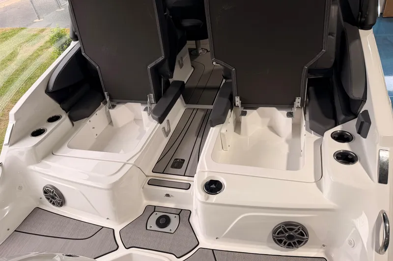 Slide: The Image of 2025 Hurricane Sundeck SD 2600 OB boat interior with seating and cup holders. - 25