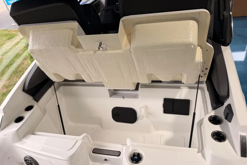 Slide: The Image of 2025 Hurricane Sundeck SD 2600 OB boat interior with open storage compartment. - 26