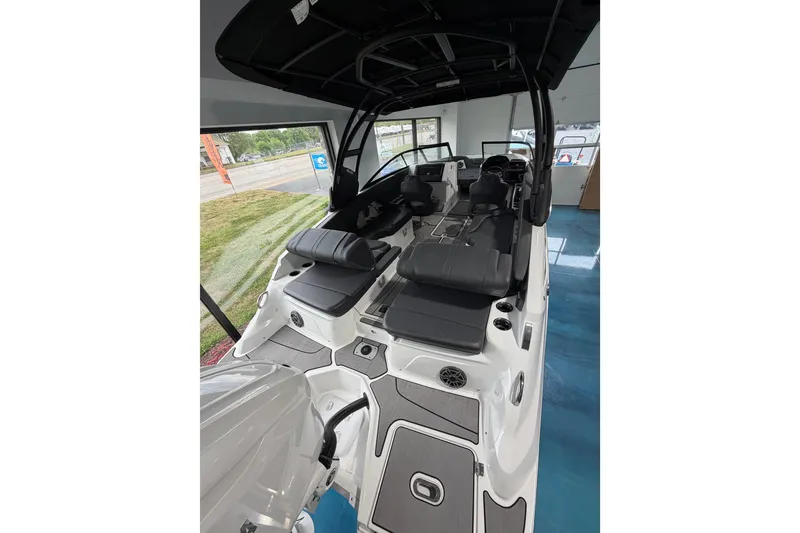 Slide: The Image of 2025 Hurricane Sundeck SD 2600 OB boat interior with sleek seating and modern design. - 28
