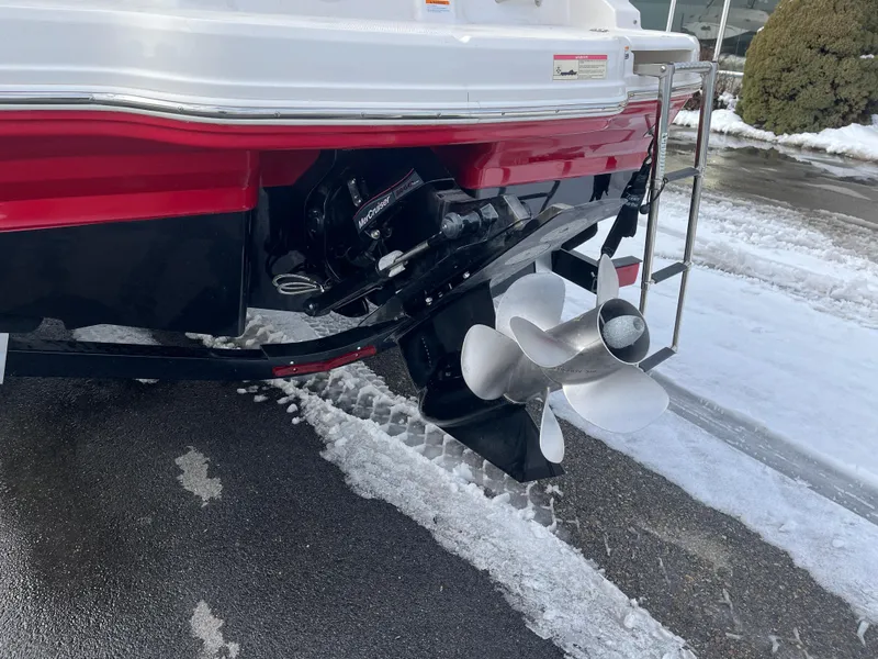 Slide: The Image of 2016 Chaparral 21 H2O boat stern with propeller on snowy ground. - 12