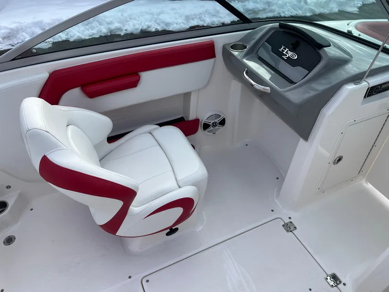 Slide: The Image of 2016 Chaparral 21 H2O boat interior with white and red seating, dashboard view. - 6