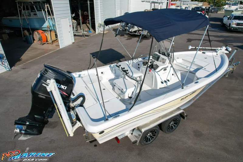 Slide: The Image of 2011 Blue Wave 2200 Pure Bay boat with Suzuki outboard motor on trailer. - 12