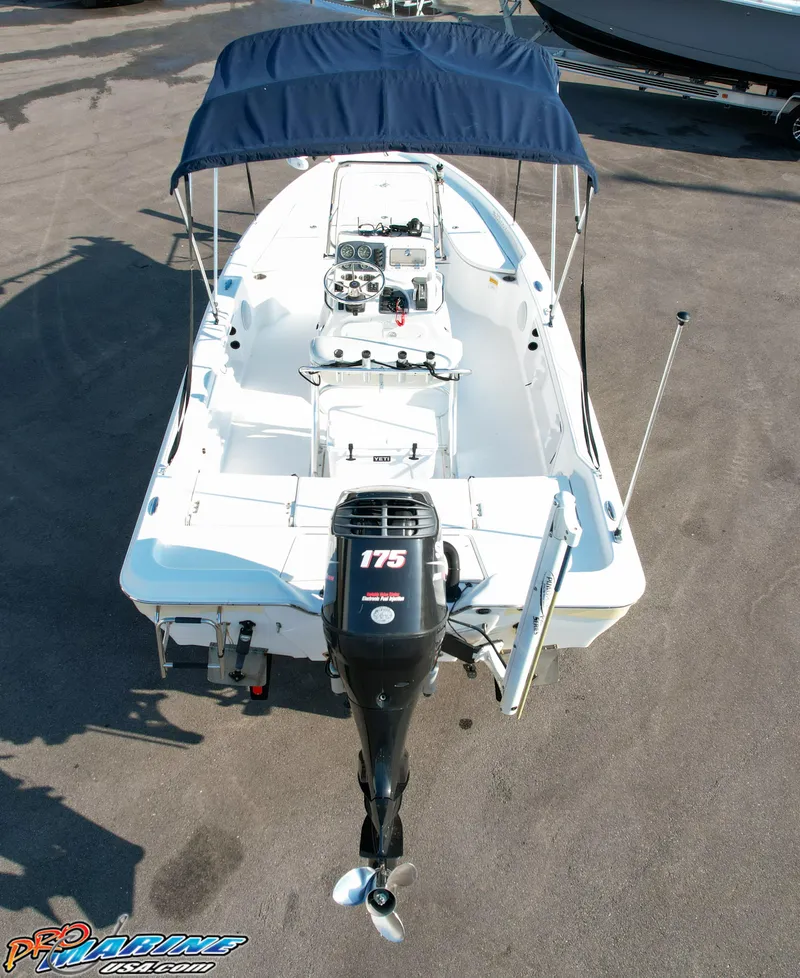 Slide: The Image of 2011 Blue Wave 2200 Pure Bay boat with canopy and 175 HP outboard motor. - 14