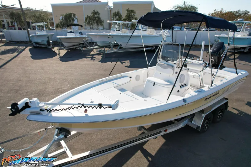 Slide: The Image of 2011 Blue Wave 2200 Pure Bay boat on trailer, parked in marina lot. - 18