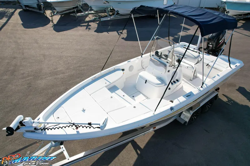 Slide: The Image of 2011 Blue Wave 2200 Pure Bay boat with canopy on trailer, ready for water adventures. - 19