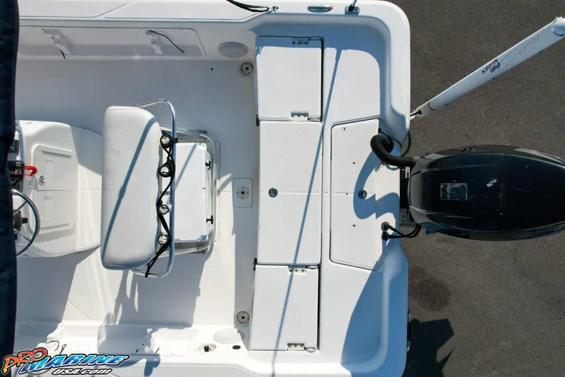 Slide: The Image of Overhead view of 2011 Blue Wave 2200 Pure Bay boat interior and motor. - 21