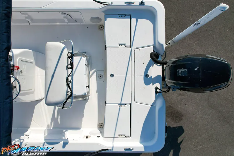 Slide: The Image of Overhead view of 2011 Blue Wave 2200 Pure Bay boat deck and motor. - 22