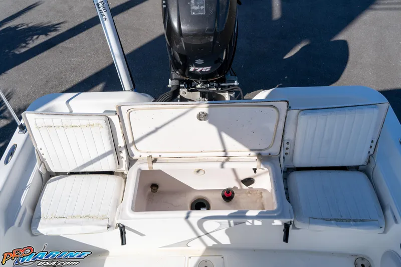 Slide: The Image of 2011 Blue Wave 2200 Pure Bay boat with open storage compartment and seating. - 25