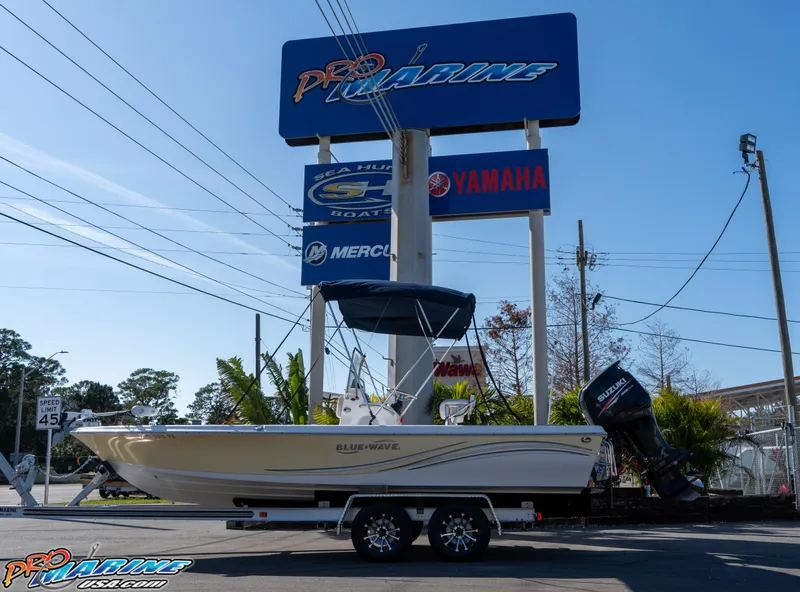 Slide: The Image of 2011 Blue Wave 2200 Pure Bay boat on trailer at Pro Marine dealership. - 3