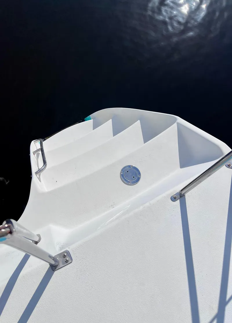 Slide: The Image of White deck of 1994 PDQ 32 Classic boat with metal railings. - 12