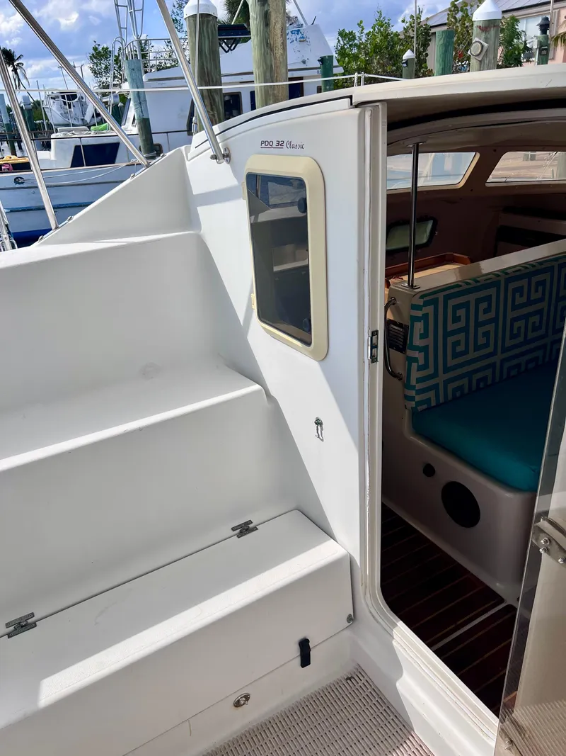 Slide: The Image of 1994 PDQ 32 Classic boat interior with stairs and seating area. - 26