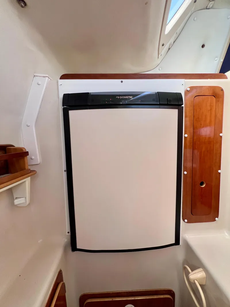 Slide: The Image of Compact Dometic fridge in 1994 PDQ 32 Classic boat interior. - 33
