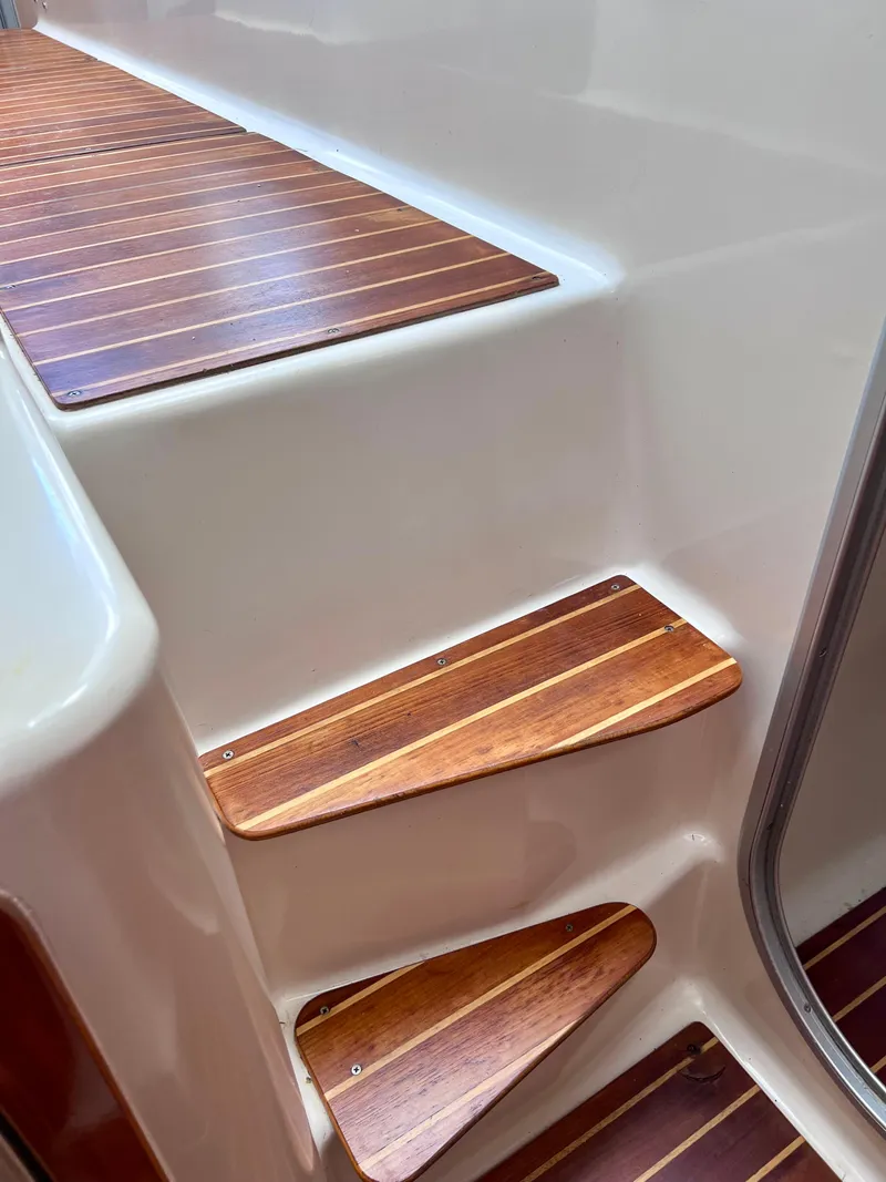 Slide: The Image of Wooden steps on a 1994 PDQ 32 Classic boat interior. - 44