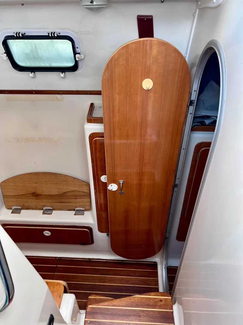 Slide: The Image of Interior of 1994 PDQ 32 Classic boat with wooden cabinetry and flooring. - 46