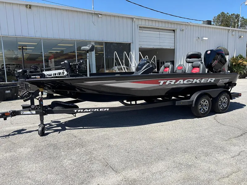 The Image of 2025 Tracker Savage 215 boat on trailer outside dealership. - 1