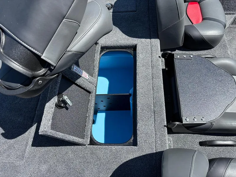 Slide: The Image of Interior of 2025 Tracker Savage 215 boat with storage compartment and seating. - 17