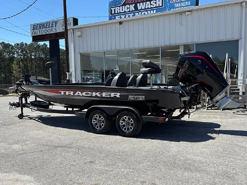 Slide: The Image of 2025 Tracker Savage 215 boat on trailer outside dealership. - 3