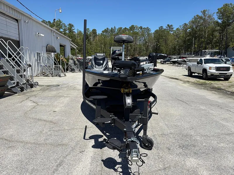 Slide: The Image of 2025 Tracker Savage 215 boat on trailer in outdoor storage area. - 4