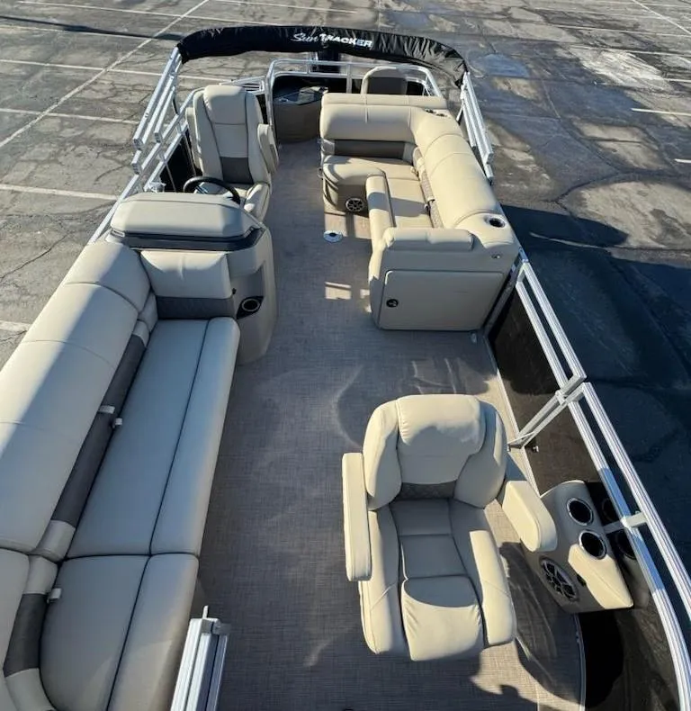 Slide: The Image of 2025 Sun Tracker SportFish 20 DLX pontoon boat with spacious seating and modern design. - 9