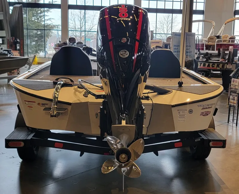 Slide: The Image of 2025 Tracker Savage 215 boat interior with Garmin navigation system and foot pedal controls. - 4