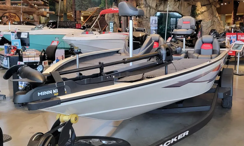 Slide: The Image of Close-up of 2025 Tracker Savage 215 boat motor in showroom setting. - 5