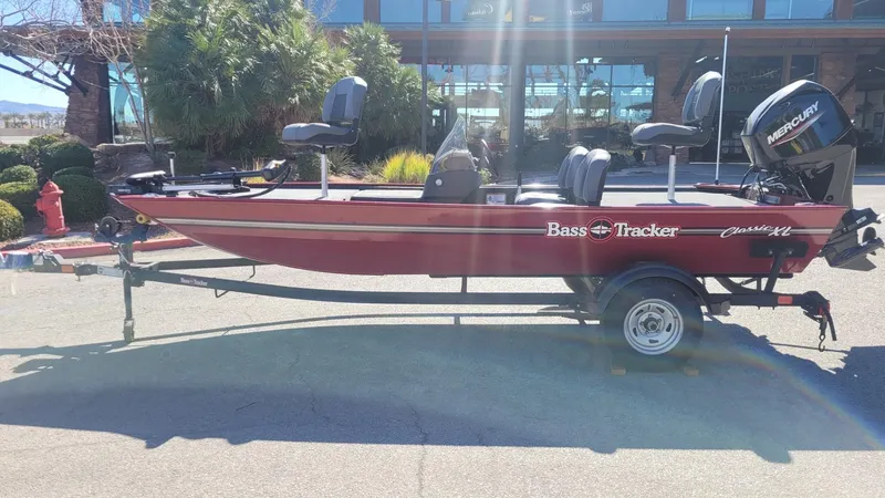 Slide: The Image of 2025 Tracker Bass Tracker Classic XL boat on trailer, parked outdoors. - 3