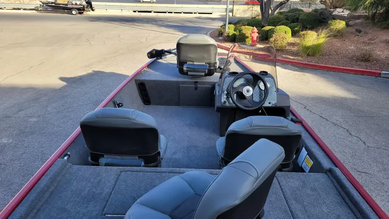Slide: The Image of 2025 Tracker Bass Tracker Classic XL boat interior with seating and steering wheel. - 5