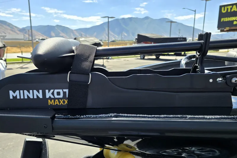 Slide: The Image of Minn Kota Maxxum trolling motor on 2025 Tracker Savage 215 boat, mountain backdrop. - 100