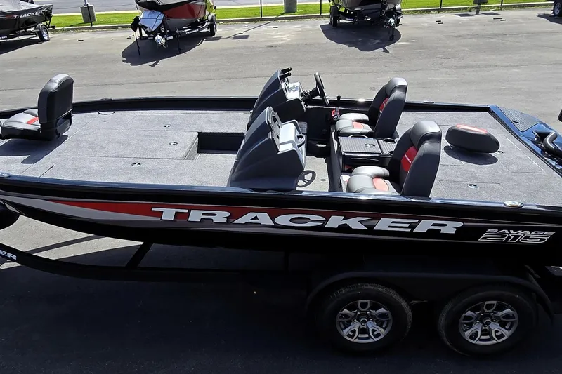 Slide: The Image of 2025 Tracker Savage 215 boat with seating, parked on a trailer. - 93