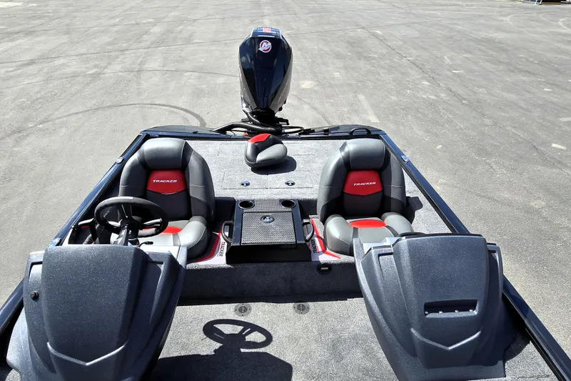 Slide: The Image of 2025 Tracker Savage 215 boat interior with dual seats and steering wheel. - 97
