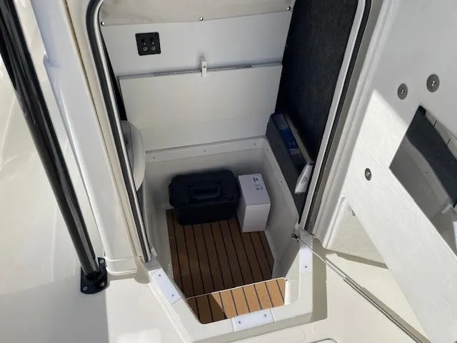 Slide: The Image of Interior view of 2025 Ranger 2510 Bay boat storage compartment. - 10