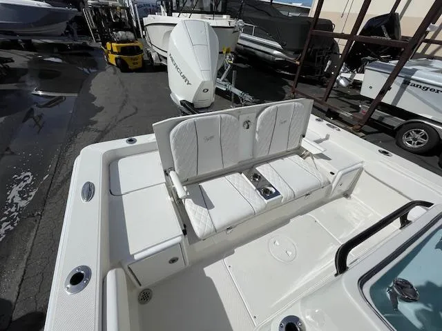 Slide: The Image of 2025 Ranger 2510 Bay boat with white seating and Mercury outboard engine. - 8