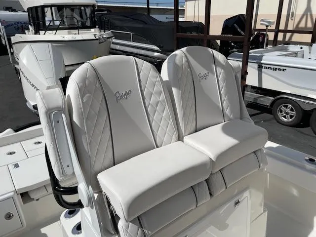 Slide: The Image of 2025 Ranger 2510 Bay boat with luxurious white seating and elegant design. - 9