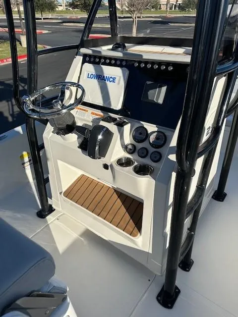 Slide: The Image of 2023 Ranger 2510 Bay boat console with steering wheel and navigation system. - 4