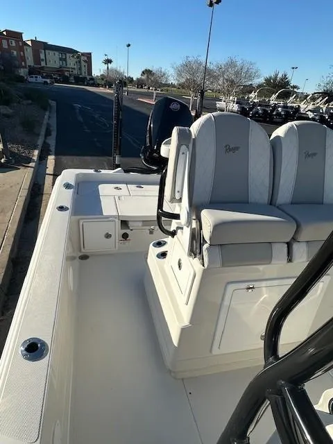 Slide: The Image of 2023 Ranger 2510 Bay boat with cushioned seating and sleek design. - 5