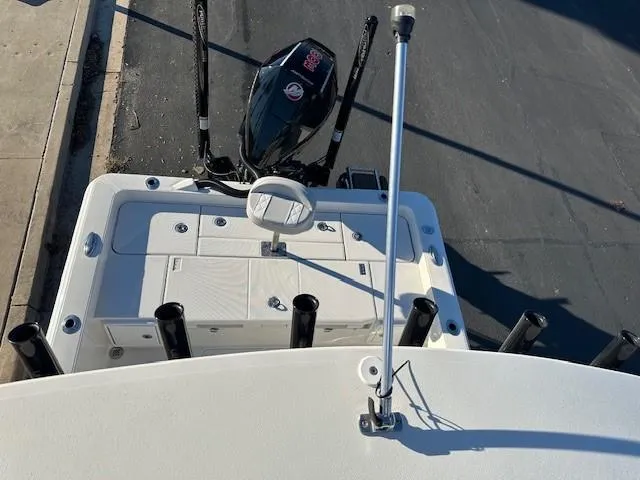 Slide: The Image of 2023 Ranger 2510 Bay boat with motor and fishing rod holders. - 8