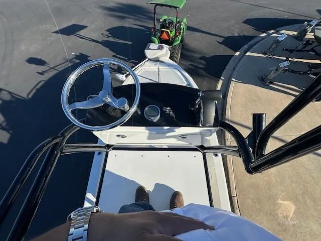 Slide: The Image of Overhead view of 2023 Ranger 2510 Bay boat with steering wheel and dashboard. - 9