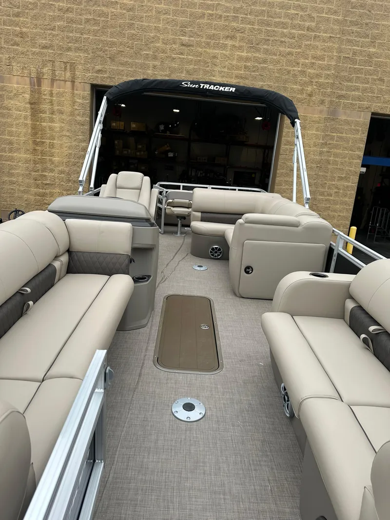 Slide: The Image of 2025 Sun Tracker SportFish 22 XP3 pontoon boat with spacious seating and modern design. - 4