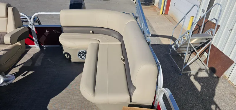 Slide: The Image of 2025 Sun Tracker Bass Buggy 16 XL Select pontoon boat with beige seating. - 12
